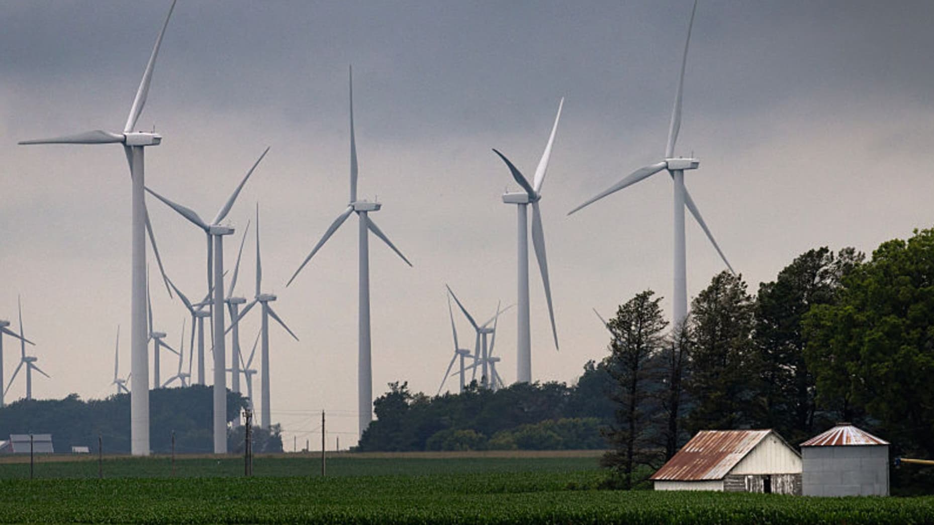 POMEROY, IOWA - JULY 05: Power generating wind turbines tower over the rural landscape on July 05, 2025 near Pomeroy, Iowa. The Trump administration's One Big Beautiful Bill Act is expected to negatively affect the clean energy sector by eliminating tax credits that have helped to spur the growth of wind and solar energy production. Iowa has more wind turbines than any other state with the exception of Texas, a state more than 4 times its size. (Photo by Scott Olson/Getty Images)